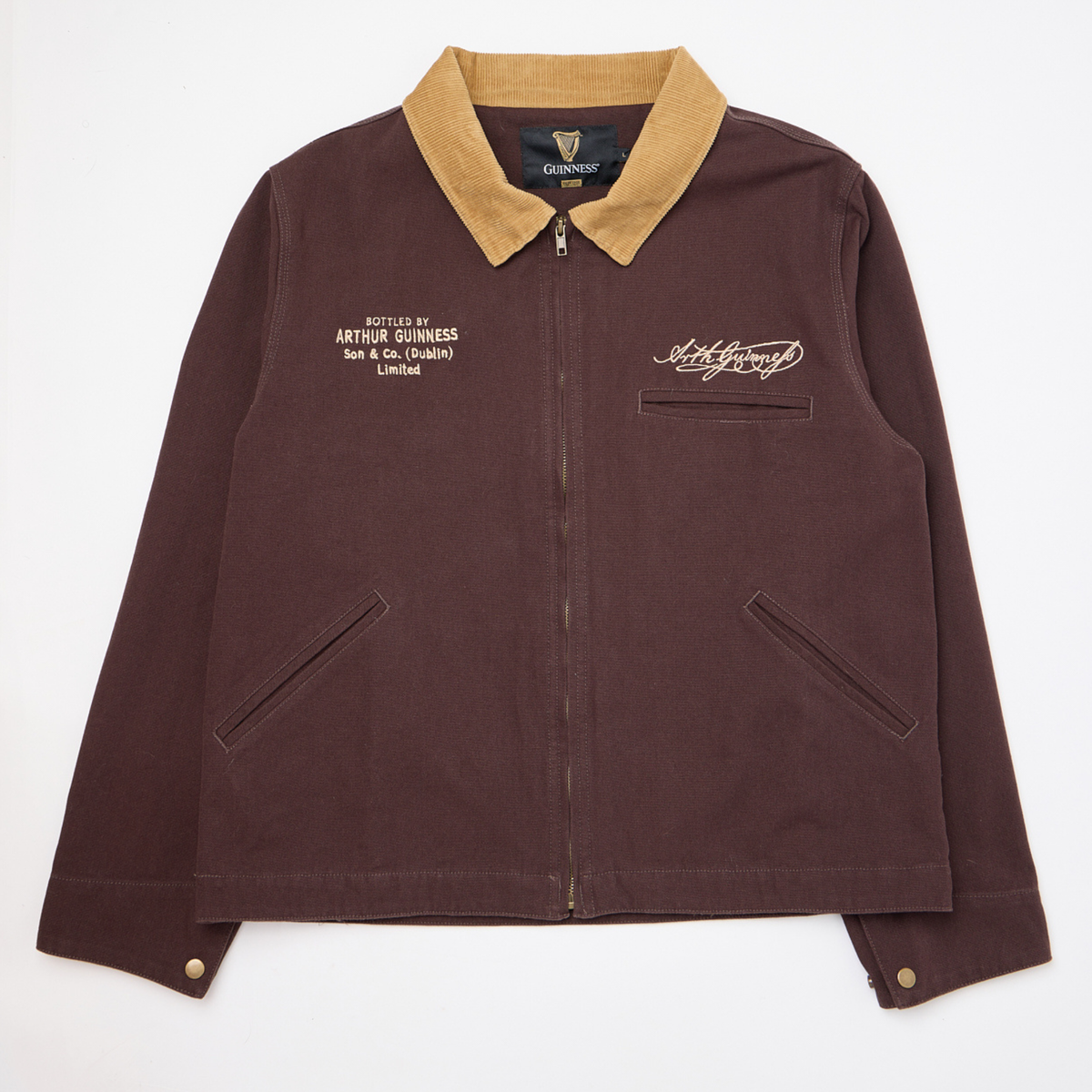 Guinness Cooperage Work Jacket in brown with tan corduroy collar, front zipper, two slant pockets, and embroidered Guinness branding on the left chest.