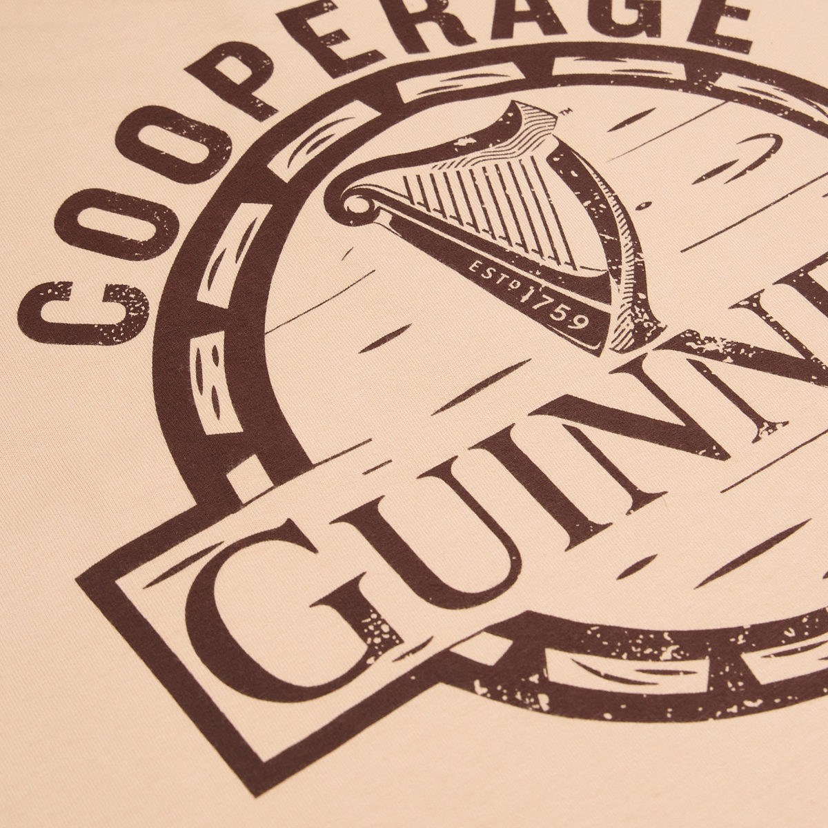 Close-up of the Guinness Cooperage Ivory Heavyweight Tee by Guinness Webstore US, featuring “GUINNESS,” a harp, and “ESTD 1759” on an ivory heavyweight fabric.