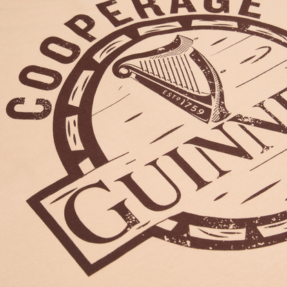 Close-up of the Guinness Cooperage Ivory Heavyweight Tee by Guinness Webstore US, featuring “GUINNESS,” a harp, and “ESTD 1759” on an ivory heavyweight fabric.