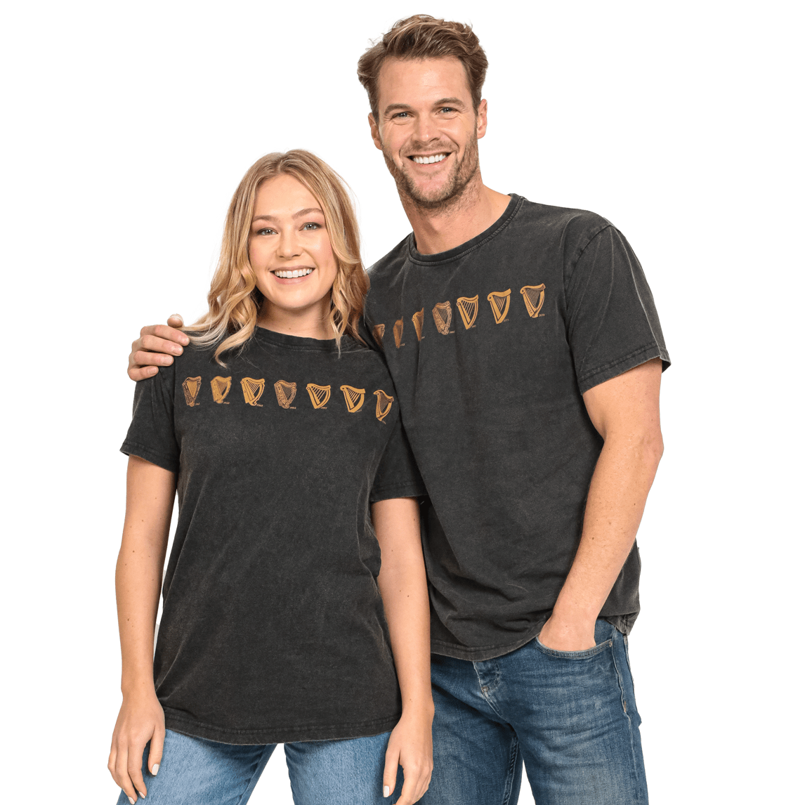 A man and woman standing next to each other wearing black Guinness Evolution Harp Tees.