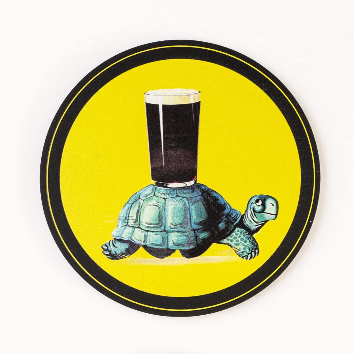 A black and yellow Guinness Toucan Coasters - Pack of 4 featuring a turtle. Perfect gift for beer lovers.