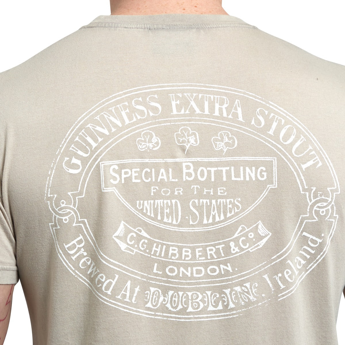 The back of a man wearing a Guinness Trademark Label T-Shirt Beige made of cotton.