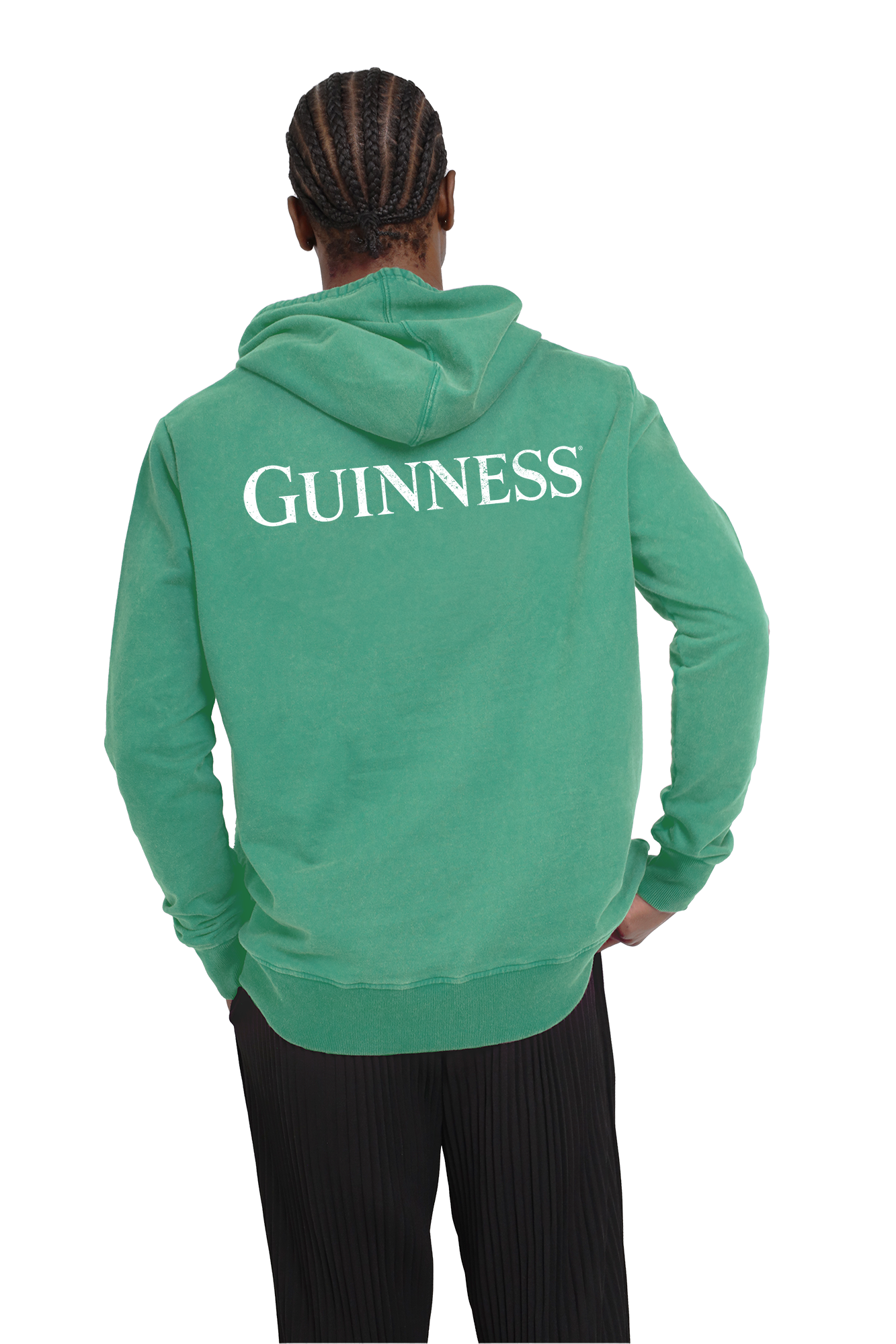 A man is seen wearing a green Guinness Evolution Harp Green Hoodie made from BCI cotton, showcasing his support for sustainable fashion.