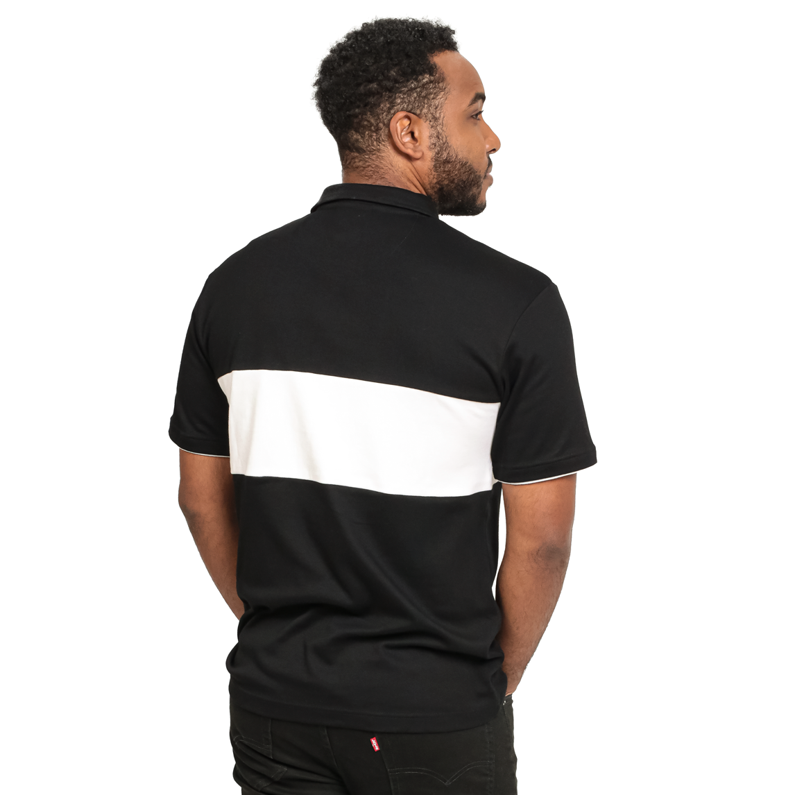The back view of a man wearing a Guinness Black and White Toucan Short Sleeve Rugby shirt.