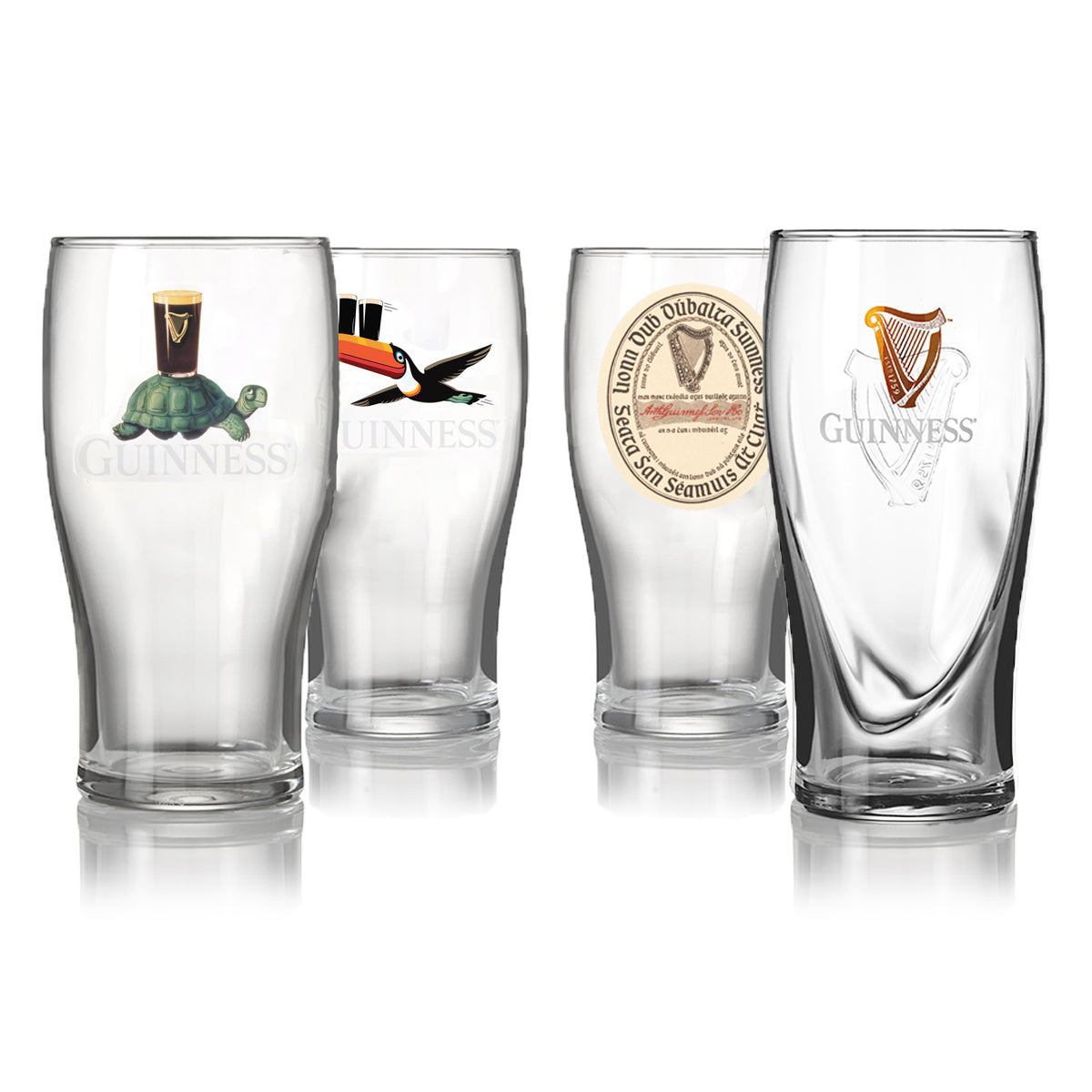 The Ultimate Guinness Pint Glass Gift Set (4-Pack) from Guinness Webstore US includes four clear pint glasses, each featuring a unique design: a turtle with a pint, toucan with a pint, vintage label, and iconic harp—ideal for your home bar.