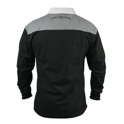 The back view of a Guinness Heritage Charcoal Grey & Black Long-Sleeve Rugby shirt made with cotton fabric.