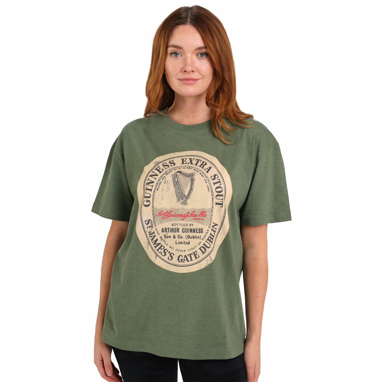 A woman wearing a green Distressed Irish Label Tee adorned with the Irish flag, perfect for your SEO-optimized product description from Guinness.