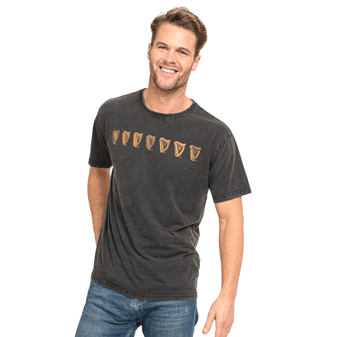 A man is smiling while wearing a black Guinness Evolution Harp Tee.