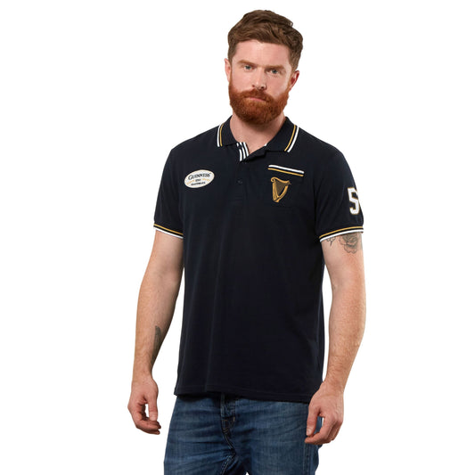 A Guinness enthusiast from Dublin, sporting a stylish Guinness Black Pique Polo Shirt.
