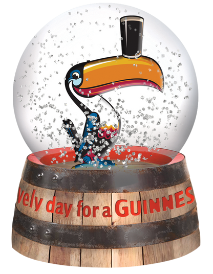 A merchandise featuring a Guinness Waterball Toucan enclosed in a Guinness snow globe waterball.