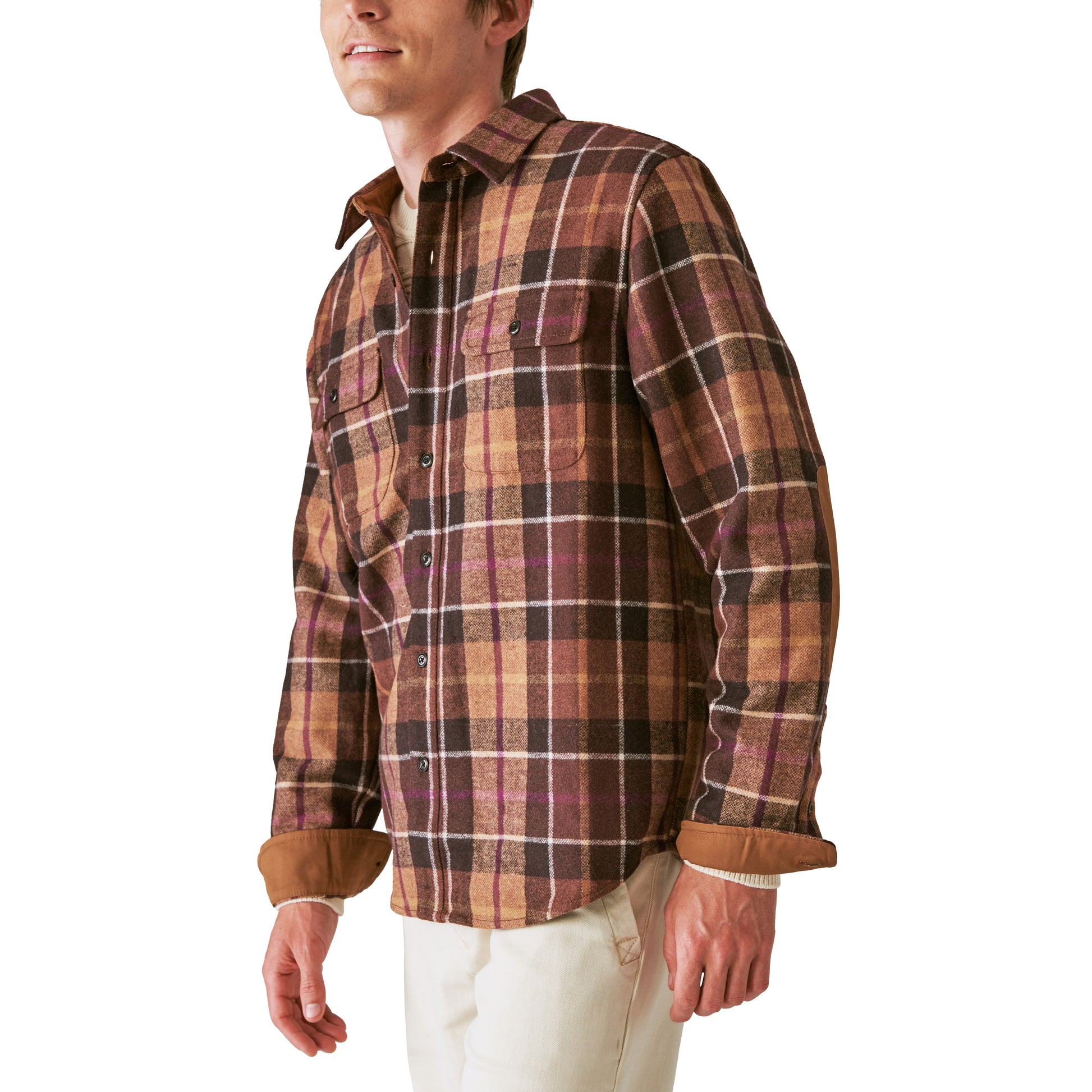 A man wearing a Guinness Wool Plaid Over Shirt With Elbow Patch - Brown Plaid from the Guinness Webstore US.