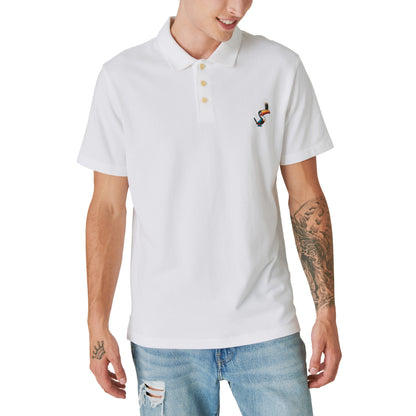 A man wearing a Limited Edition Guinness Polo - Bright White from the Guinness Webstore US and jeans.