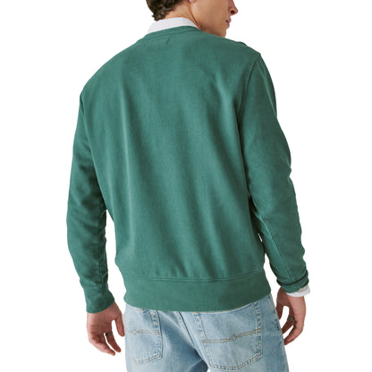 The back view of a man wearing a Guinness Fleece Logo Crewneck sweatshirt from the Guinness Webstore US.