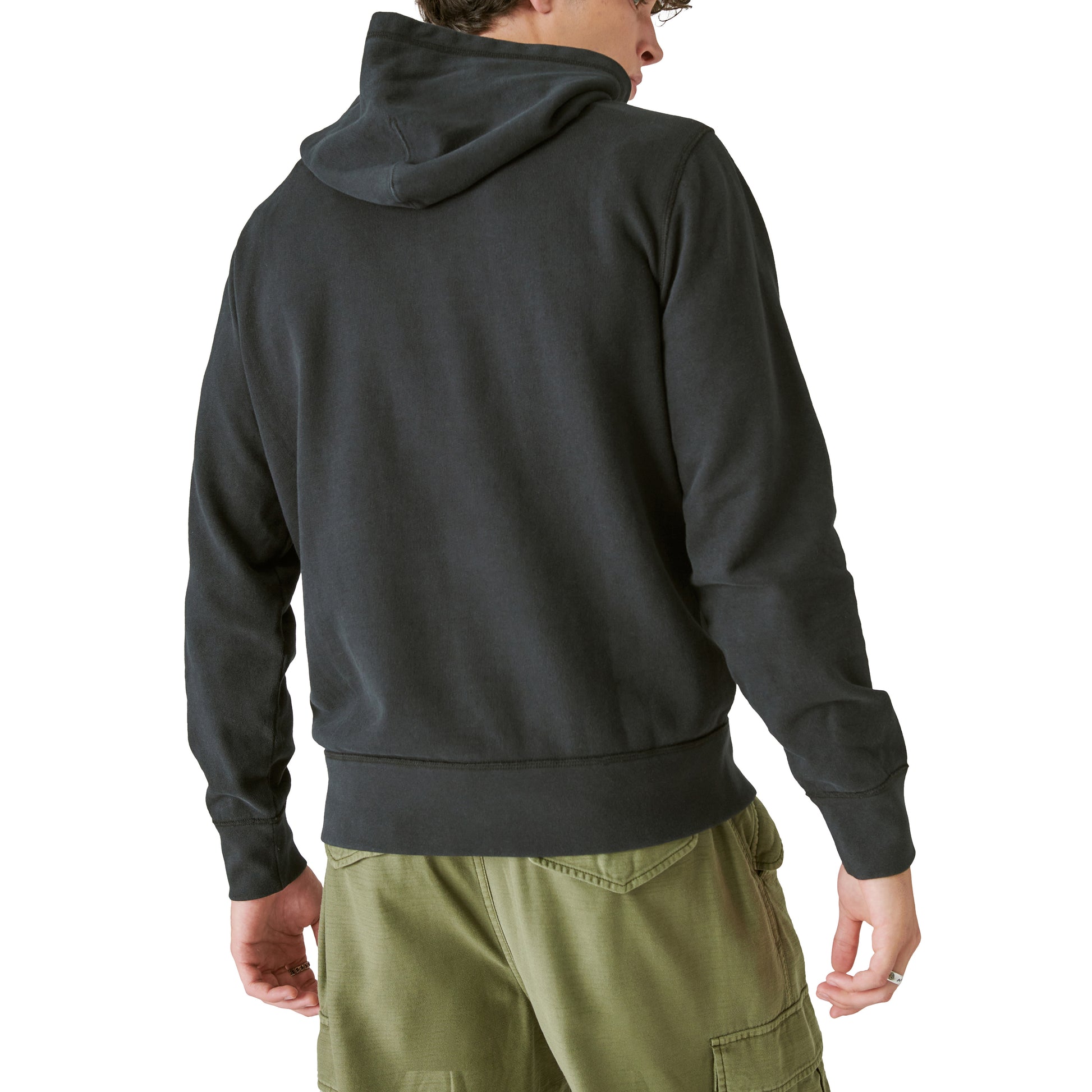 The limited edition Guinness Logo Hoodie showcases the back view of a man sporting a versatile black Lucky Brand hoodie available on the Guinness Webstore US.