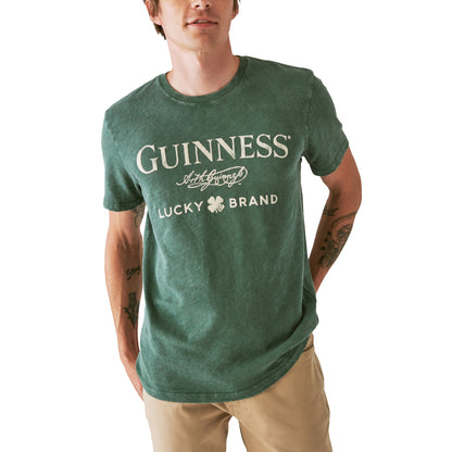 A man wearing a limited edition Guinness Webstore US Cobrand Tee.