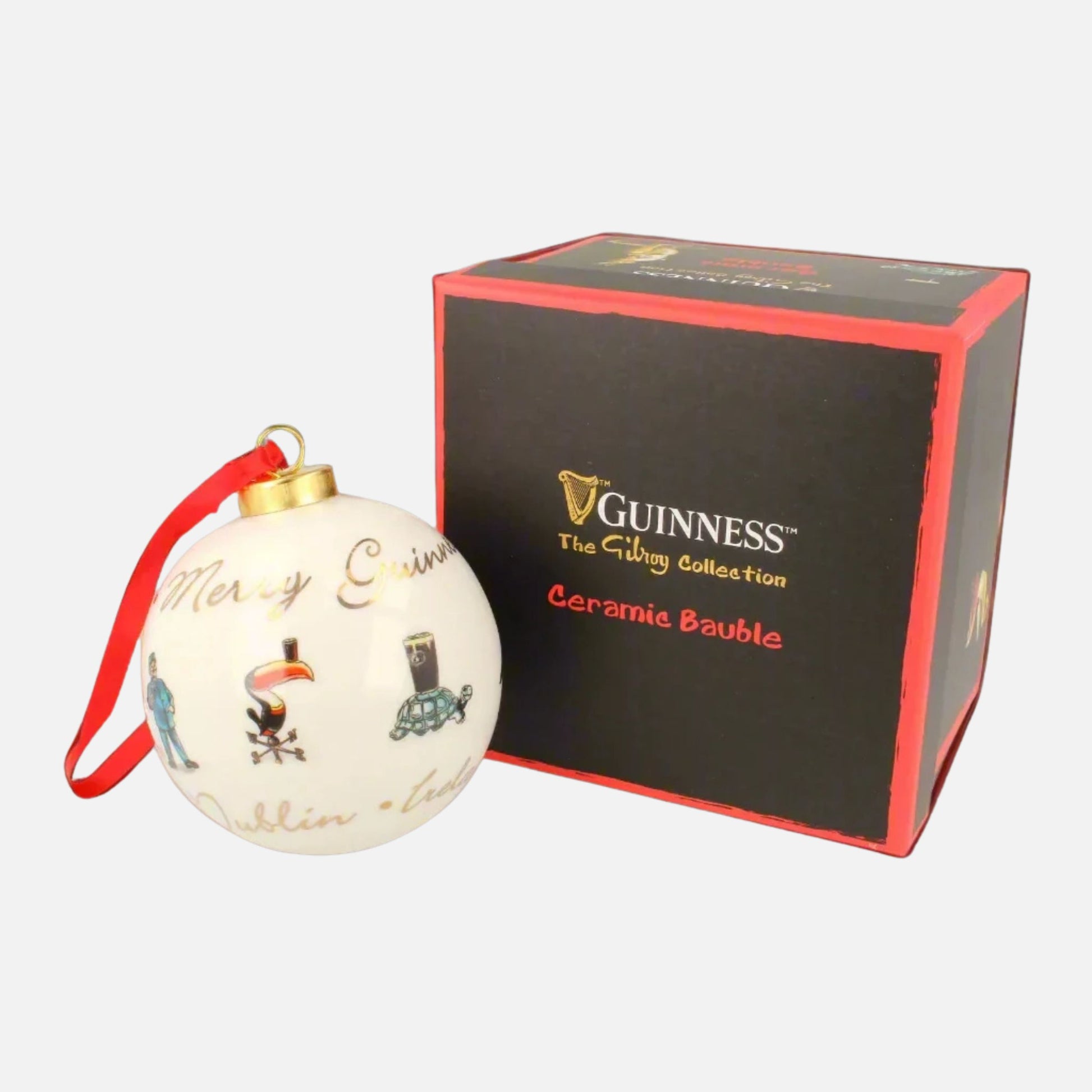 The Guinness Gilroy Ceramic Holiday Bauble features festive designs and comes with a branded box labeled “Guinness Gilroy Ceramic Holiday Bauble.”.