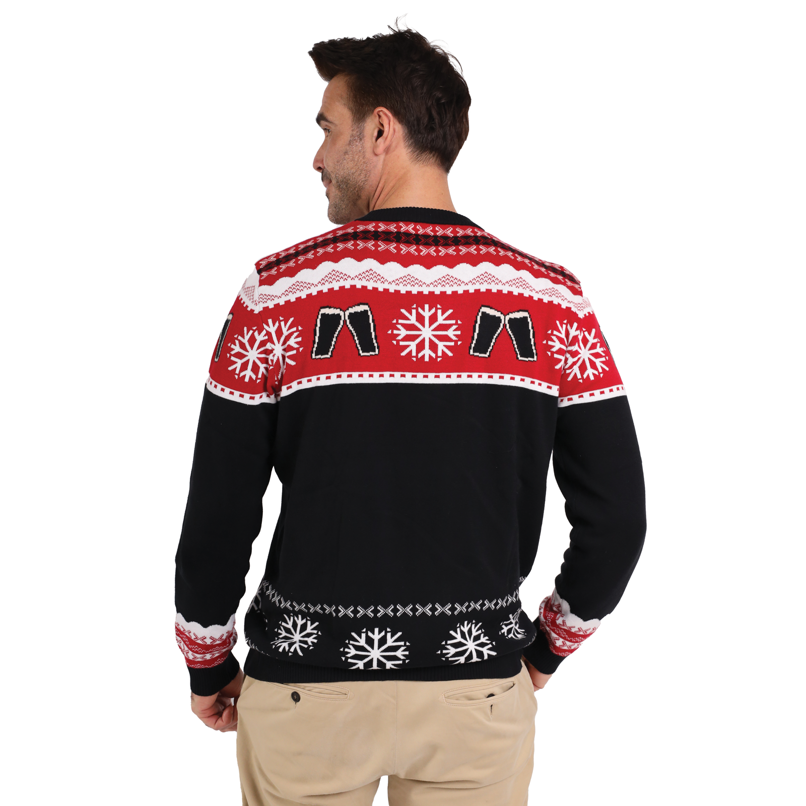 A man faces away, wearing the Official Guinness Holiday Sweater by Guinness featuring red, white, and black patterns with snowflakes and festive shapes—an ideal addition to your holiday wardrobe.