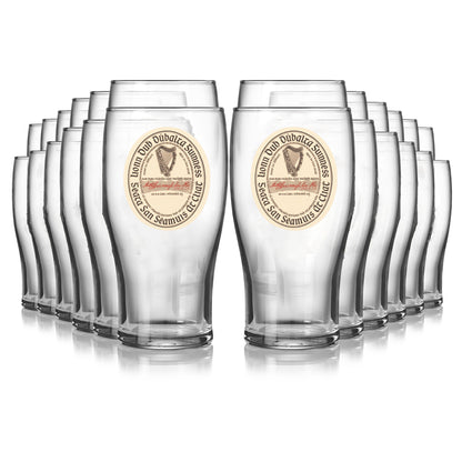 Twenty-four Guinness Vintage Label Pint Glasses from Guinness Webstore US are arranged in four rows, with the front two glasses prominently displayed and the rest behind, creating a striking Extra Stout collection.