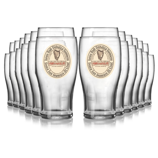Twenty-four Guinness Vintage Label Pint Glasses from Guinness Webstore US are arranged in four rows, with the front two glasses prominently displayed and the rest behind, creating a striking Extra Stout collection.