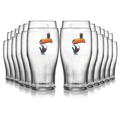 A 24-pack of Guinness pint glasses featuring the iconic Guinness logo and a toucan graphic with a top hat, arranged in four rows.