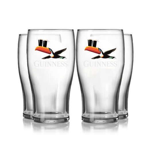 The Guinness Gilroy Flying Toucan Pint Glass - 4 Pack from Guinness Webstore US features four empty pint glasses with the iconic toucan balancing two pints, arranged in two rows on a white background—ideal for collectors and fans.