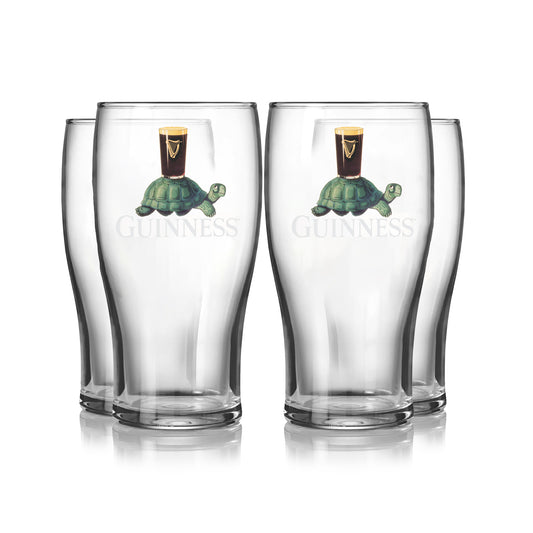 The Guinness Gilroy Tortoise Pint Glass - 4 Pack from Guinness Webstore US includes four clear 20oz glasses, each with the iconic Gilroy Tortoise carrying a pint of Guinness and "Guinness" printed below.