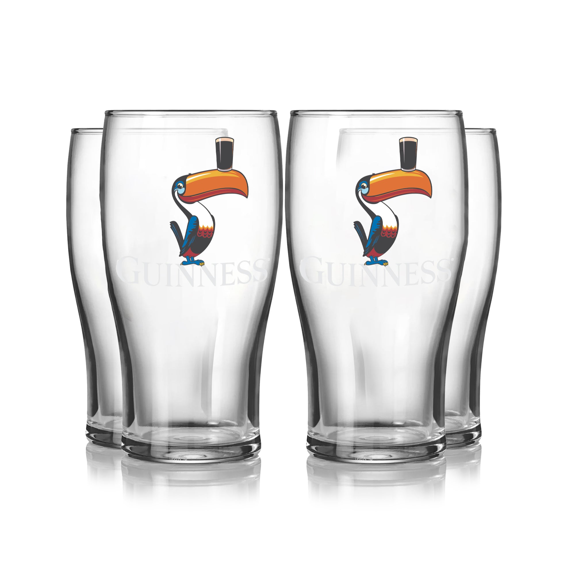 The Guinness Toucan Pint Glass 4 Pack features four clear 20 oz pint glasses, each decorated with a vibrant Guinness Toucan graphic holding a pint of stout on its beak.