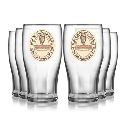A set of six Guinness Vintage Label Pint Glasses from Guinness Webstore US, inspired by St. James’s Gate Dublin heritage, are arranged in two rows on a white background.