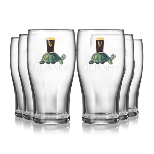 The Guinness Gilroy Tortoise Pint Glass - 6 Pack from Guinness Webstore US features six clear glasses with the iconic tortoise and pint design, inspired by John Gilroy’s classic artwork, and the Guinness logo on each glass.