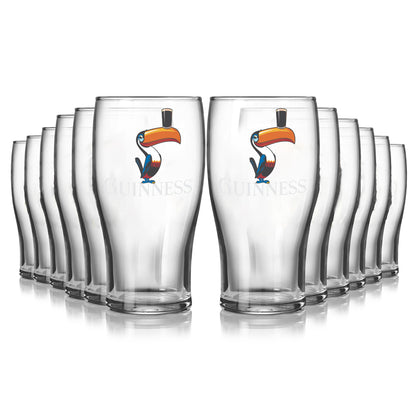 The Guinness Toucan Pint Glass 12 Pack includes twelve clear pint glasses, each with the classic Guinness logo and toucan design—perfect for your home bar and authentic Guinness merchandise.