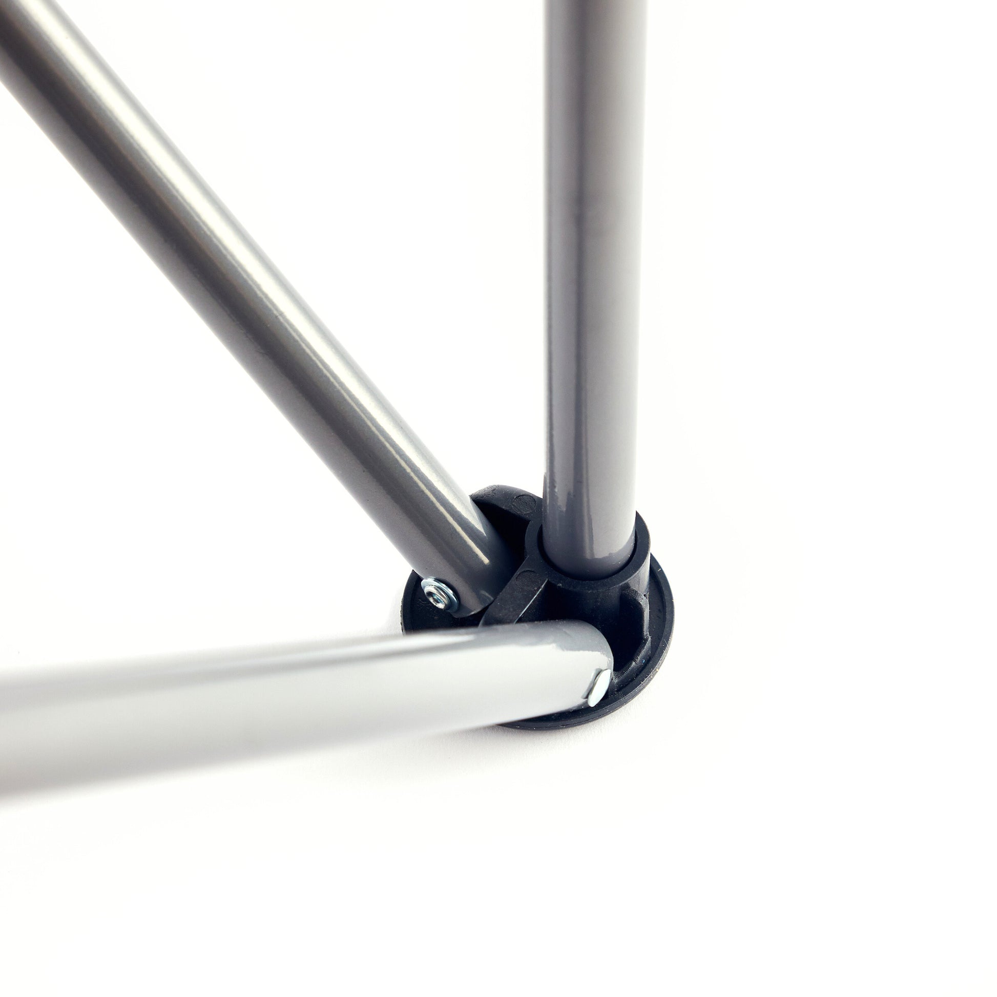 Close-up of three metal rods joining at a black plastic connector, showcasing the foldable design of the Guinness Toucan Hawaiian Beach Chair by Guinness Webstore US, all set against a white background.