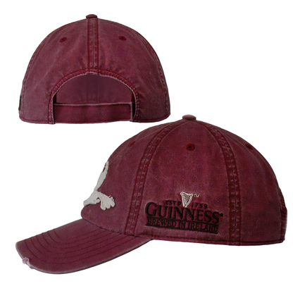 The Guinness Red Toucan Cap from Guinness Webstore US features visible stitching, a front logo and text, a skull and crossbones emblem, and an adjustable strap—ideal for fans of Guinness or Irish stout.
