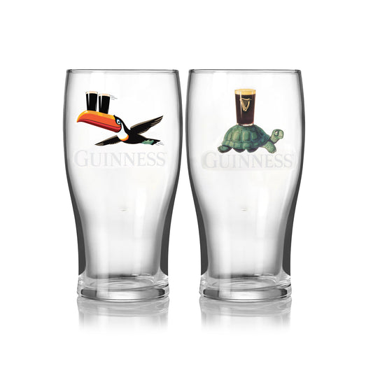 The Guinness Gilroy Toucan & Tortoise Pint Glass Set from Guinness Webstore US includes two clear pint glasses: one with a vintage toucan holding a pint, the other with a tortoise carrying a pint.