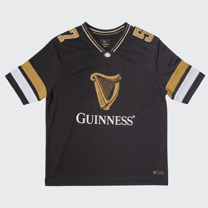 The Guinness Black American Football Jersey from Guinness Webstore US is a black, short-sleeve jersey with gold and white accents. It features a harp logo and the word “Guinness” on the front, along with the number 59 on the shoulders—a standout piece of Guinness apparel.