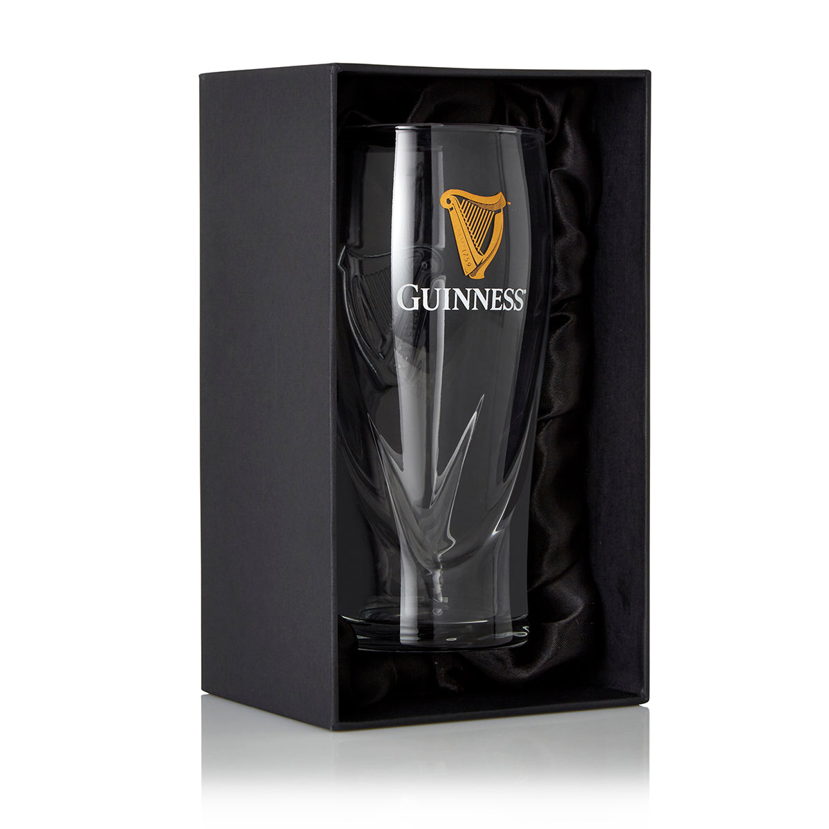 The Guinness Pint Glass Luxury Gift Box from Guinness Webstore US features a clear pint glass with a gold logo, presented upright in a black gift box lined with black fabric—the ideal gift for any Guinness fan.