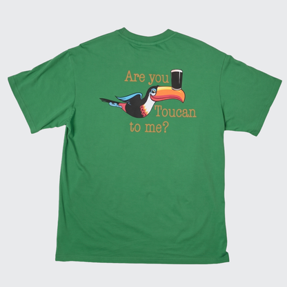 The Guinness Gilroy Toucan Tee – Green from Guinness Webstore US showcases a playful cartoon toucan balancing a pint of beer on its beak, with “Are you Toucan to me?” printed on the back—a fun tribute to the iconic Gilroy collection.