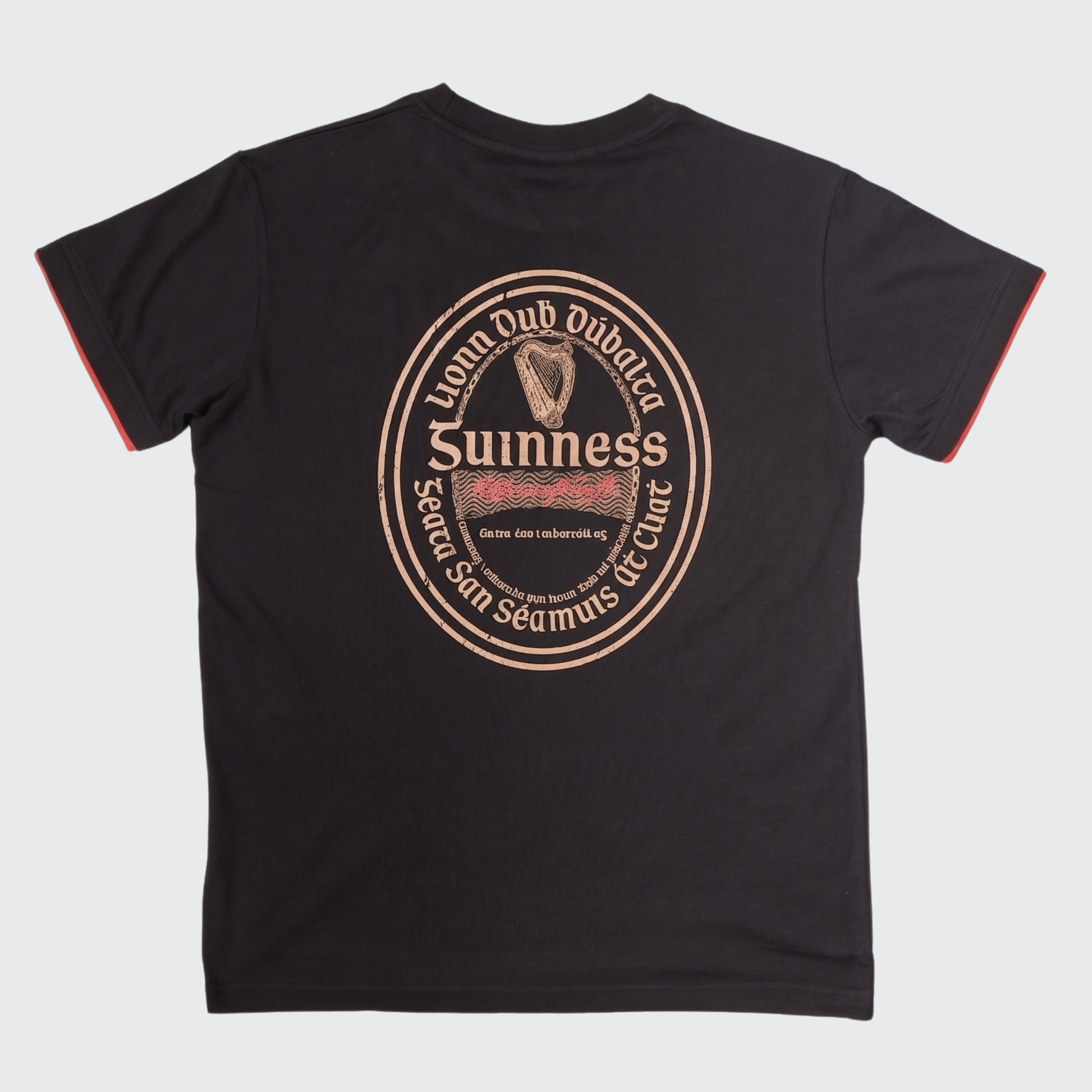 The Guinness Irish Label Black Tee from the Guinness Webstore US showcases a bold vintage-inspired Guinness label and harp graphic on the back, complete with English and Irish text and eye-catching red sleeve trim. It’s the ideal black tee for fans looking to celebrate classic Irish beer style.