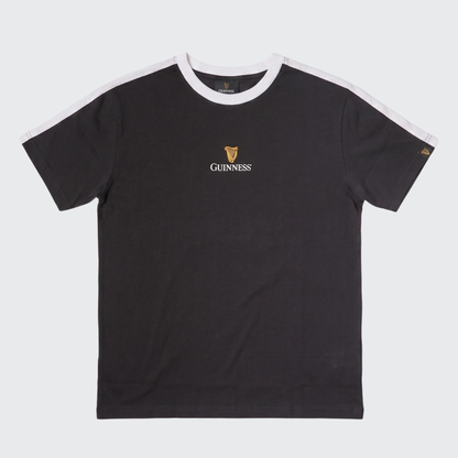 The Guinness Toucan Soccer Black Tee from Guinness Webstore US features black short sleeves, white shoulder stripes, and a small gold Guinness logo with harp emblem on the chest—offering fans a classic, iconic soccer-inspired look.