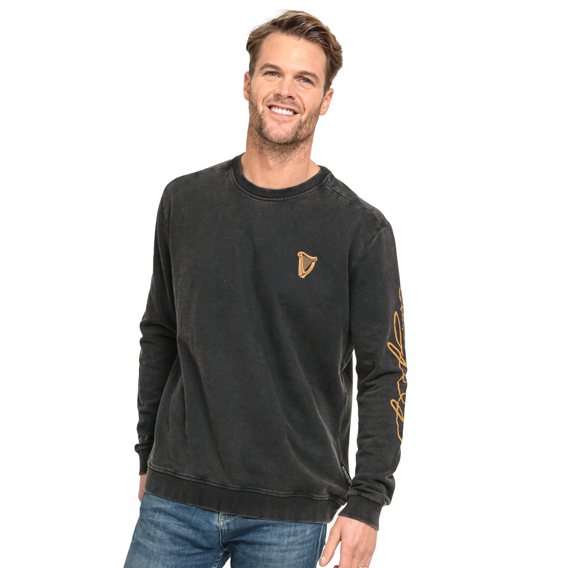 A man wearing a black Guinness Gold Harp & Signature Distressed Sweatshirt featuring a gold harp logo on the chest and gold signature text on the left sleeve.