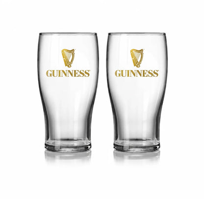 Two clear glass Guinness Vintage Gold Harp Pint Glass Twin Pack glasses, each featuring a vintage gold harp logo and the word “GUINNESS” printed in gold.