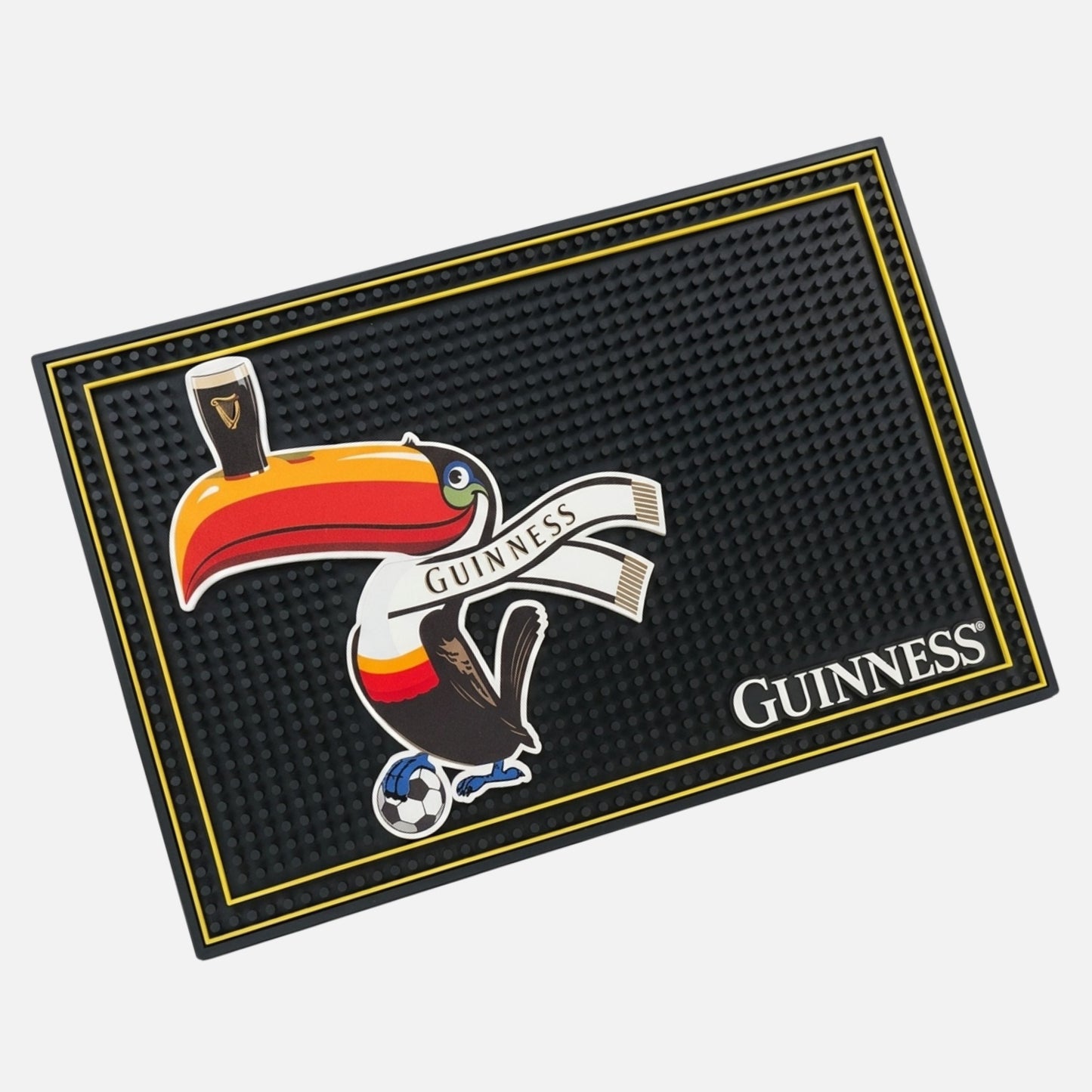 The Guinness Toucan Soccer PVC Bar Mat features a colorful toucan with a "Guinness" scarf, pint on its beak, and soccer ball at its feet—perfect for soccer fans and bar tops.
