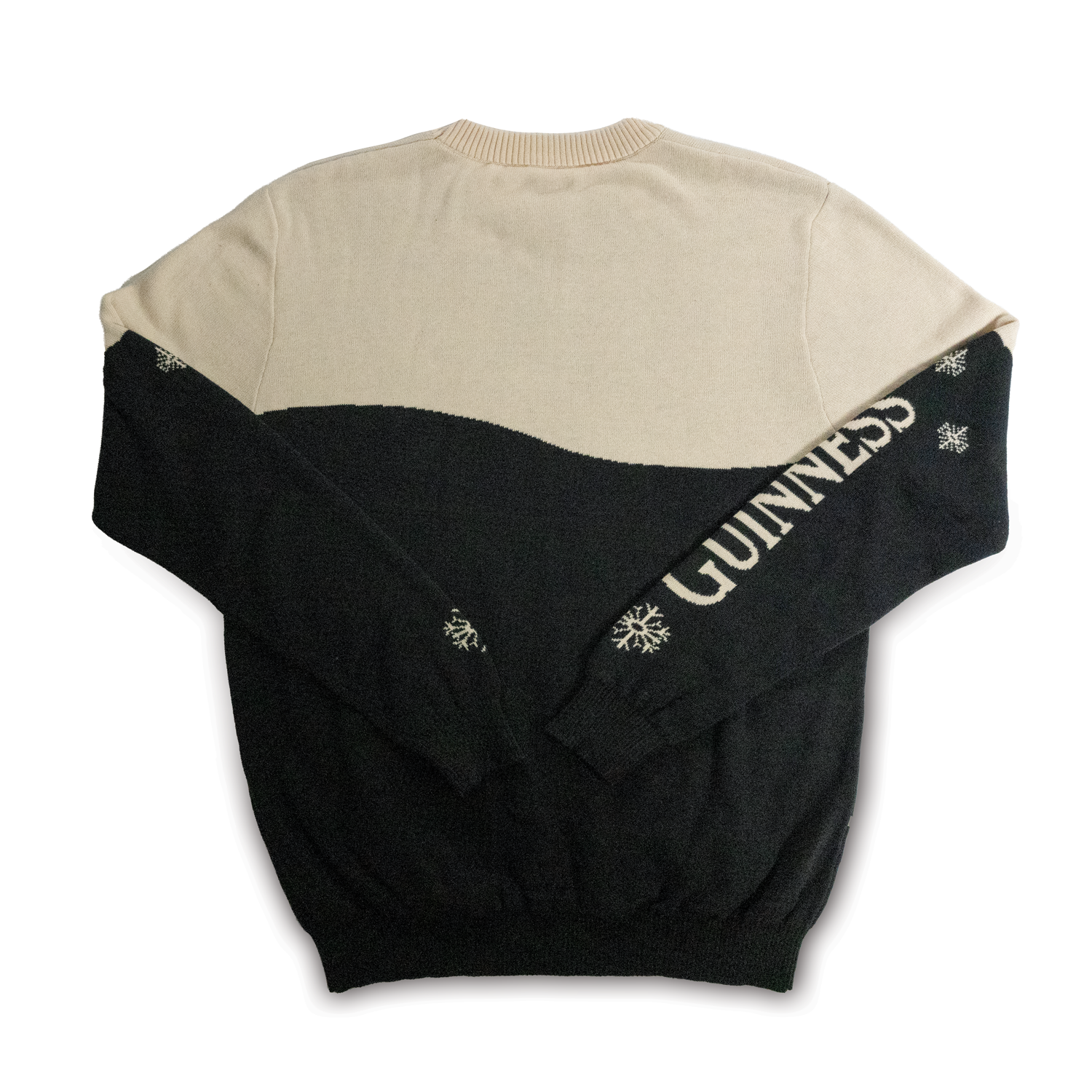 The Guinness Holiday Black and Cream Toucan Sweater from the Guinness Webstore US, featuring festive "GUINNESS" lettering and snowflake designs on the sleeves, is perfect for holiday parties.