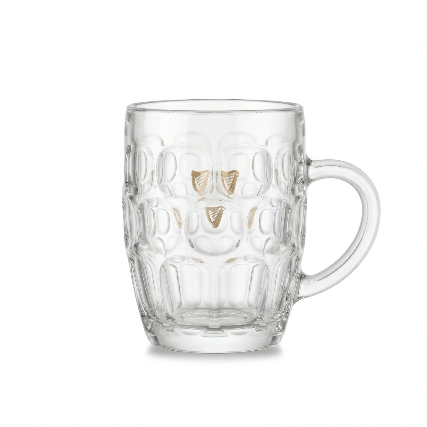 The Guinness Gold Harp Dimple Glass Mug – 20 oz Tankard from Guinness Webstore US features a classic dimpled design, sturdy handle, and clear glass with the classic gold harp logo, evoking the charm of an Irish pub mug on a white background.