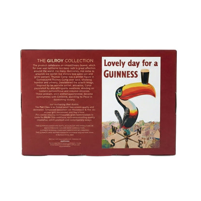 The Guinness Gilroy Toucan & Tortoise Pint Glass Set by Guinness Webstore US comes in a rectangular red box featuring "Lovely day for a Guinness," with a Flying Toucan balancing a pint on its beak and The Gilroy Collection details on the side.