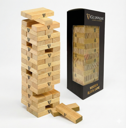 A partially collapsed Guinness Wooden Tower Game is displayed beside its packaging, highlighting this branded stacking tower challenge as a fun Guinness wooden block game.