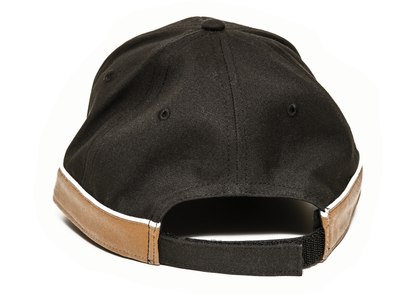 The Guinness Black and Brown Cap from the Guinness Webstore US, viewed from the back, features an adjustable strap with a Velcro closure for a customizable fit.