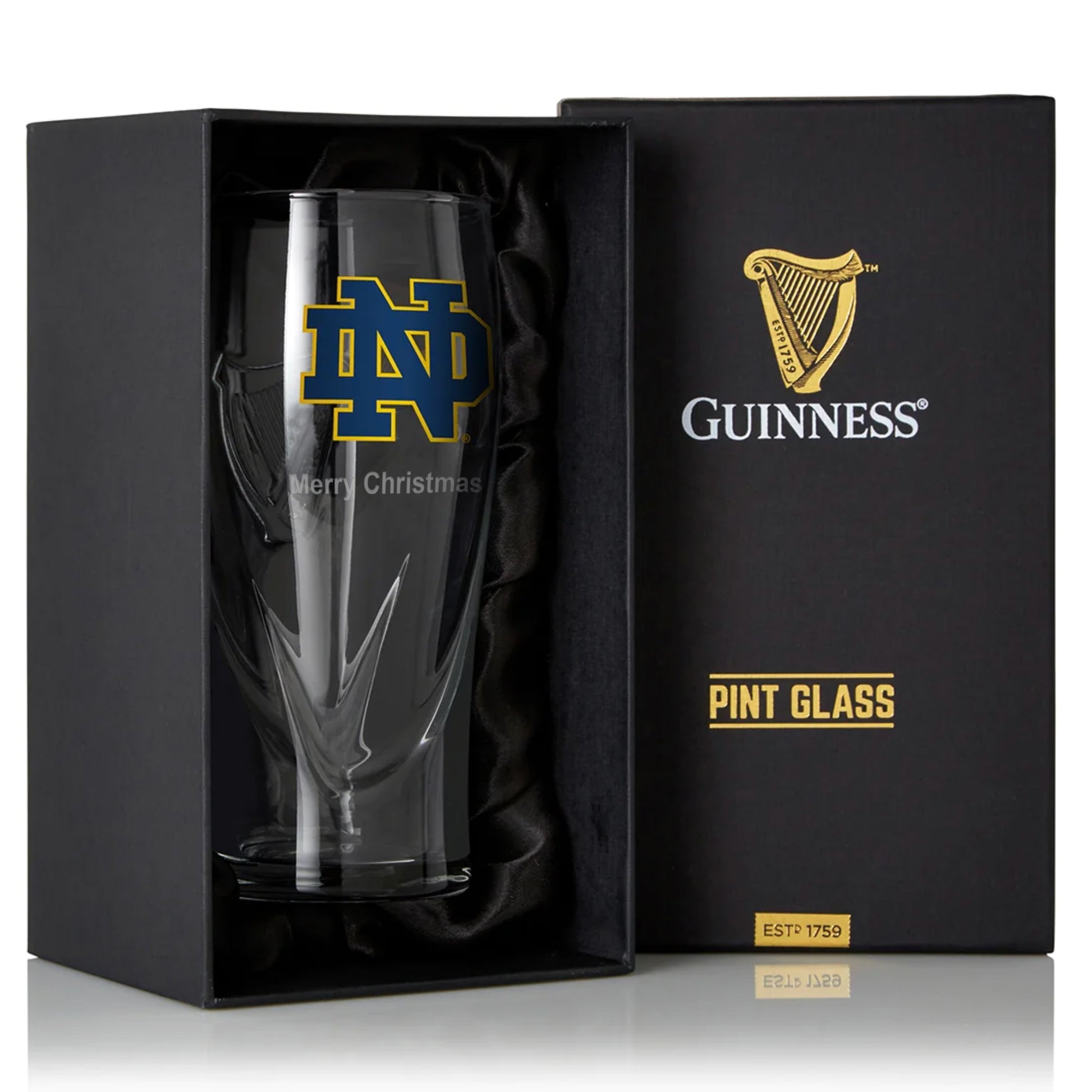 A Guinness Notre Dame 16OZ Pint Glass in a box.
