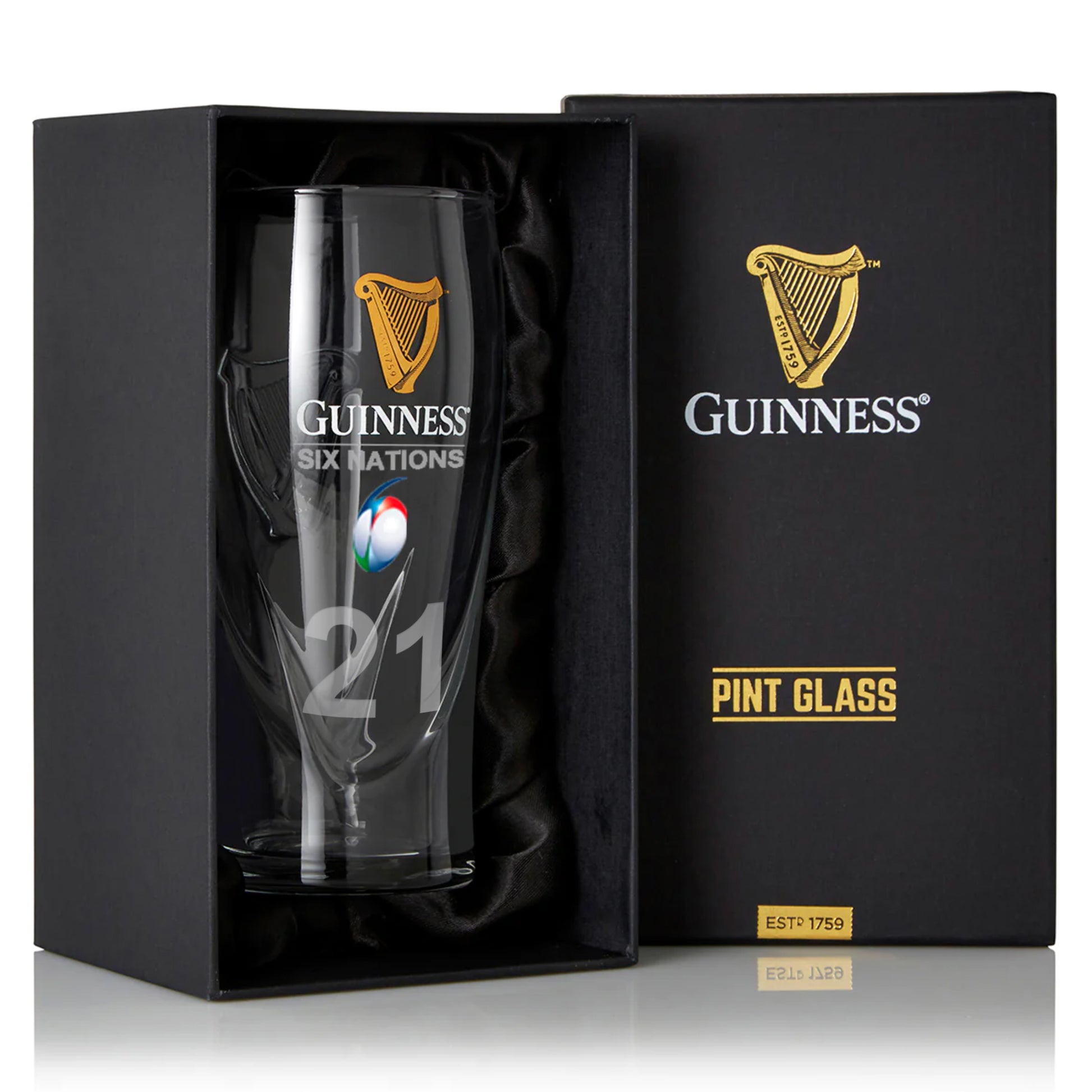 The Guinness Webstore US Six Nations Pint Glass features the iconic Harp Logo and "21" on the front, ideal for rugby fans. Comes in a stylish black gift box marked "Pint Glass.