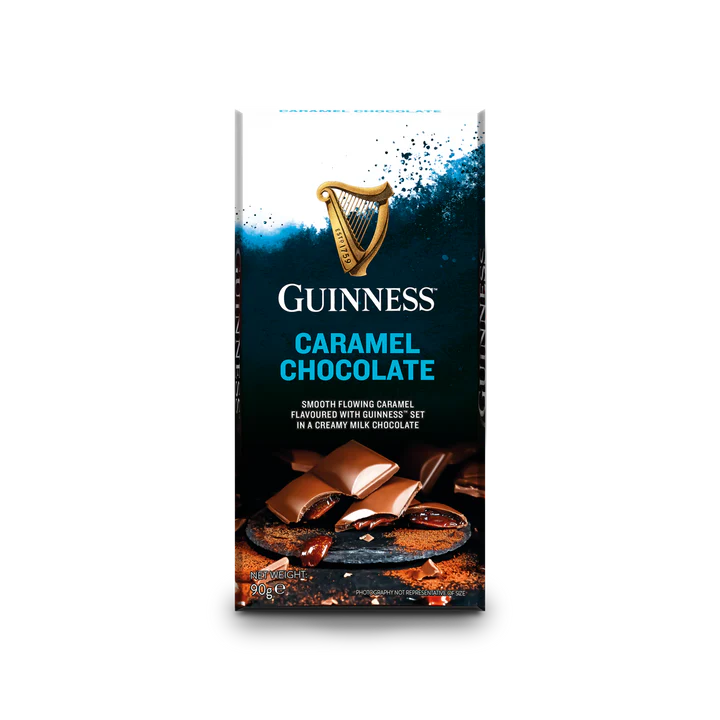 Introducing the elegant packaging of the Luxury Milk Chocolate Caramel Bar by Guinness, adorned with the iconic gold harp logo. Delight in the smooth combination of creamy Guinness milk chocolate and rich caramel pieces, masterfully crafted by Lir Chocolates for a truly indulgent experience.