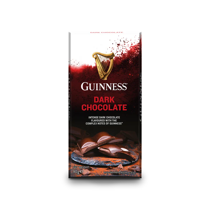 The Guinness Luxury Dark Chocolate Bar packaging features the brand's iconic gold harp logo, alongside sumptuous pieces of dark chocolate. Created by Lir Chocolates, this delightful treat guarantees an indulgent experience.